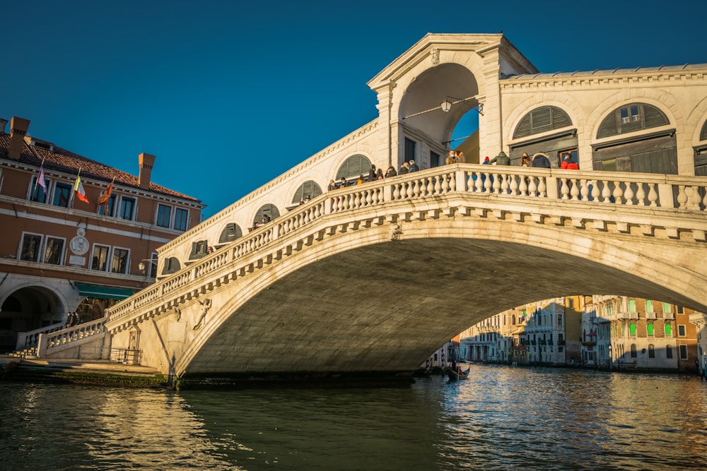 white concrete bridge over river during daytime