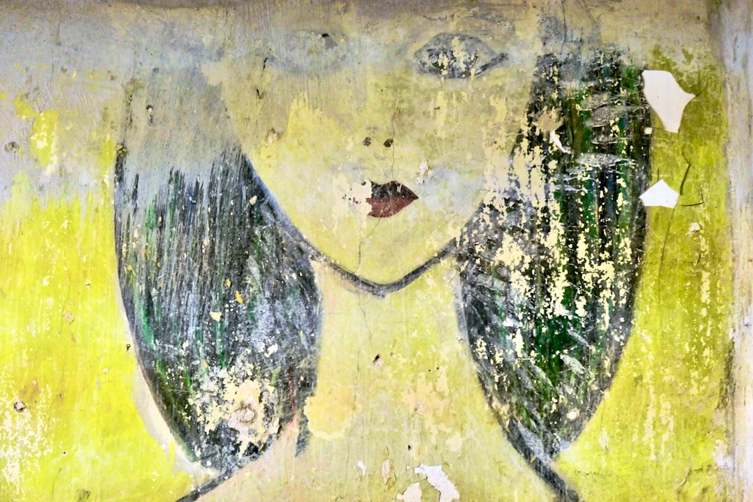 womans face in yellow and blue abstract painting