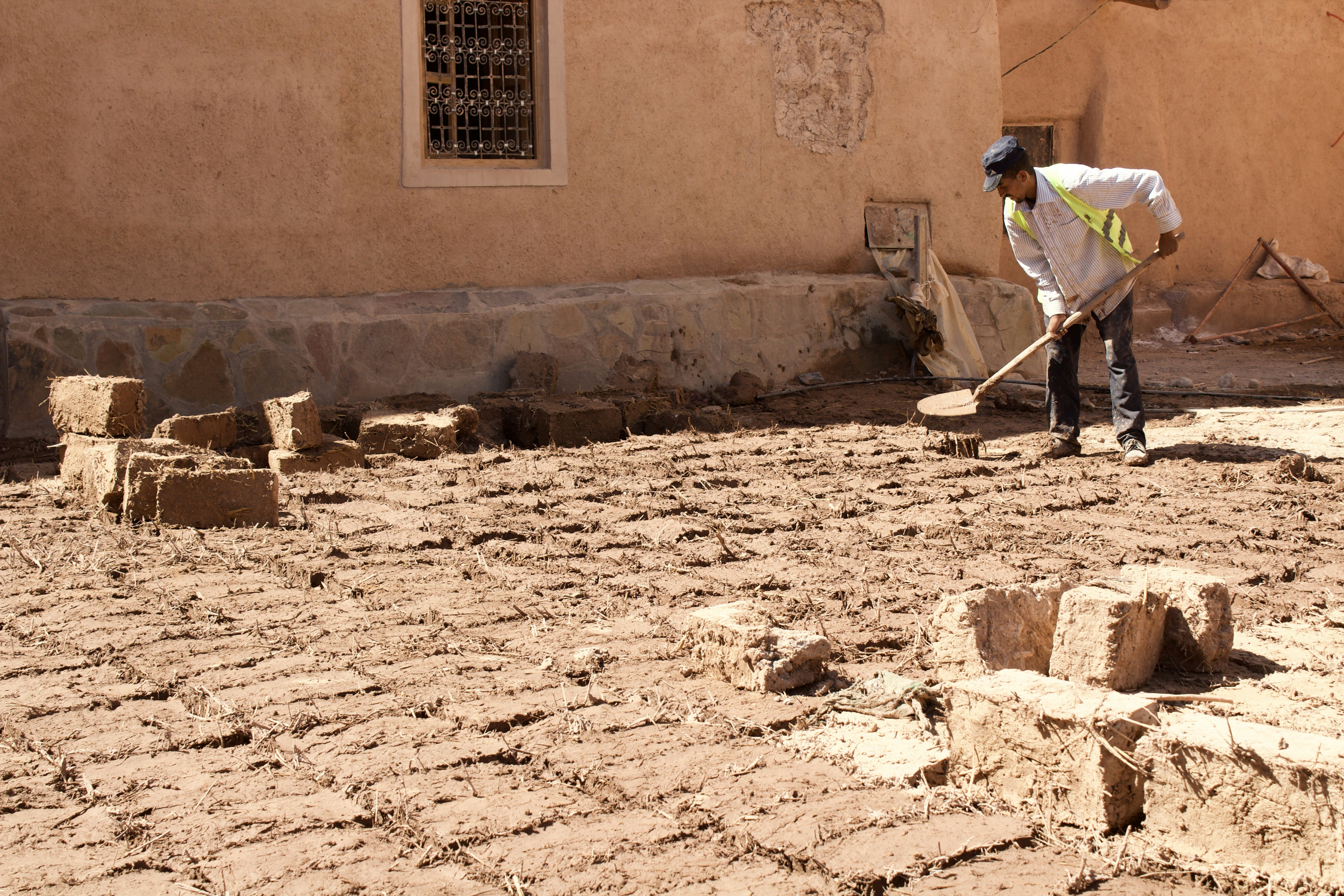 exterior foundation wall being excavated - installing french drain in basement