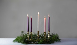 pink candles on gold candle holder