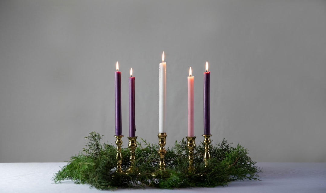 pink candles on gold candle holder,