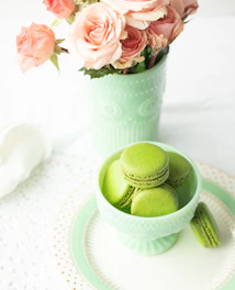 Elegant floral arrangement with soft pastel tones displayed in a luxurious setting.