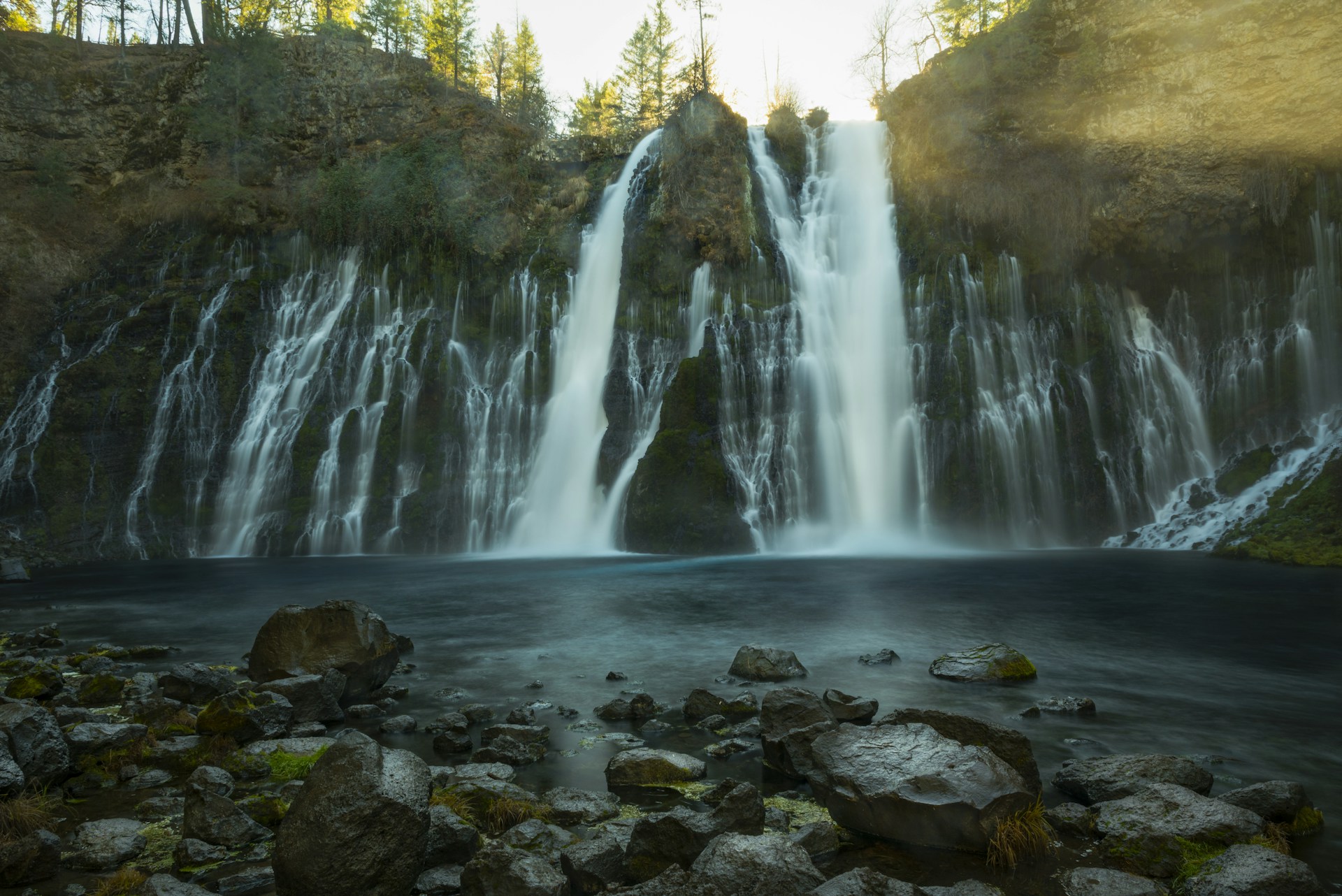 waterfalls in the forest during daytime