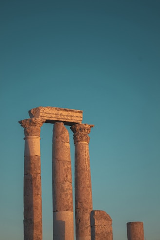 brown concrete pillar under blue sky during daytime