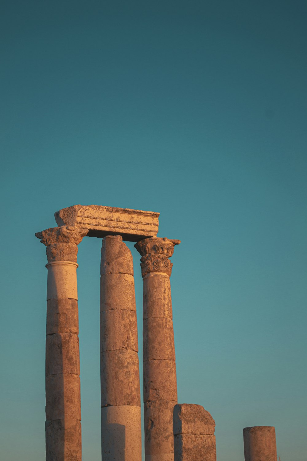 brown concrete pillar under blue sky during daytime