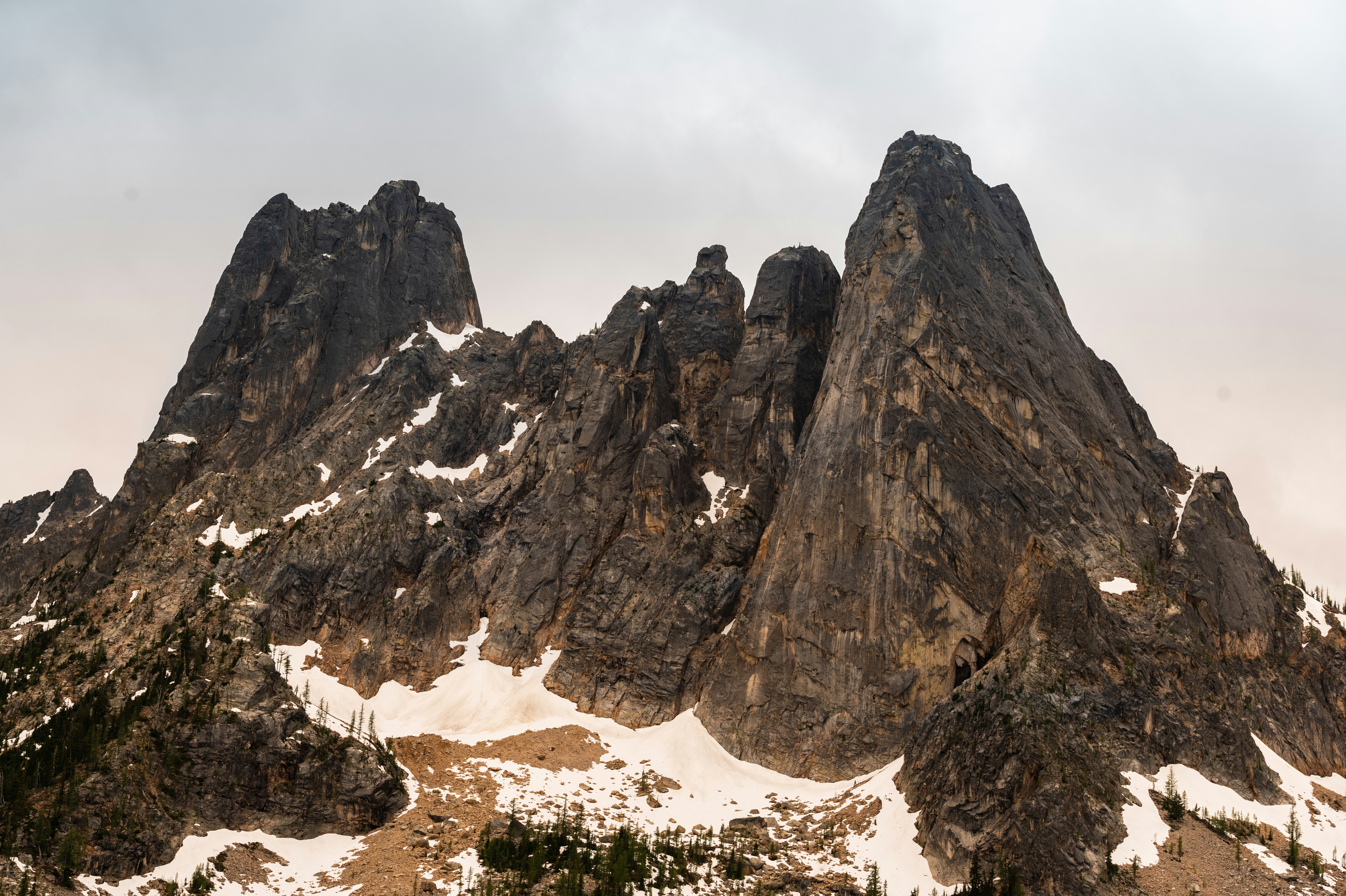 brown rocky mountain under white sky during daytime
