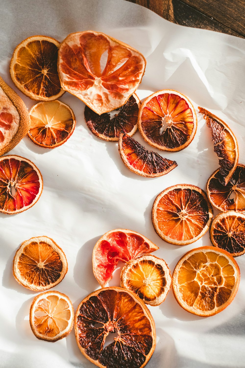 sliced orange fruits on white ceramic plate