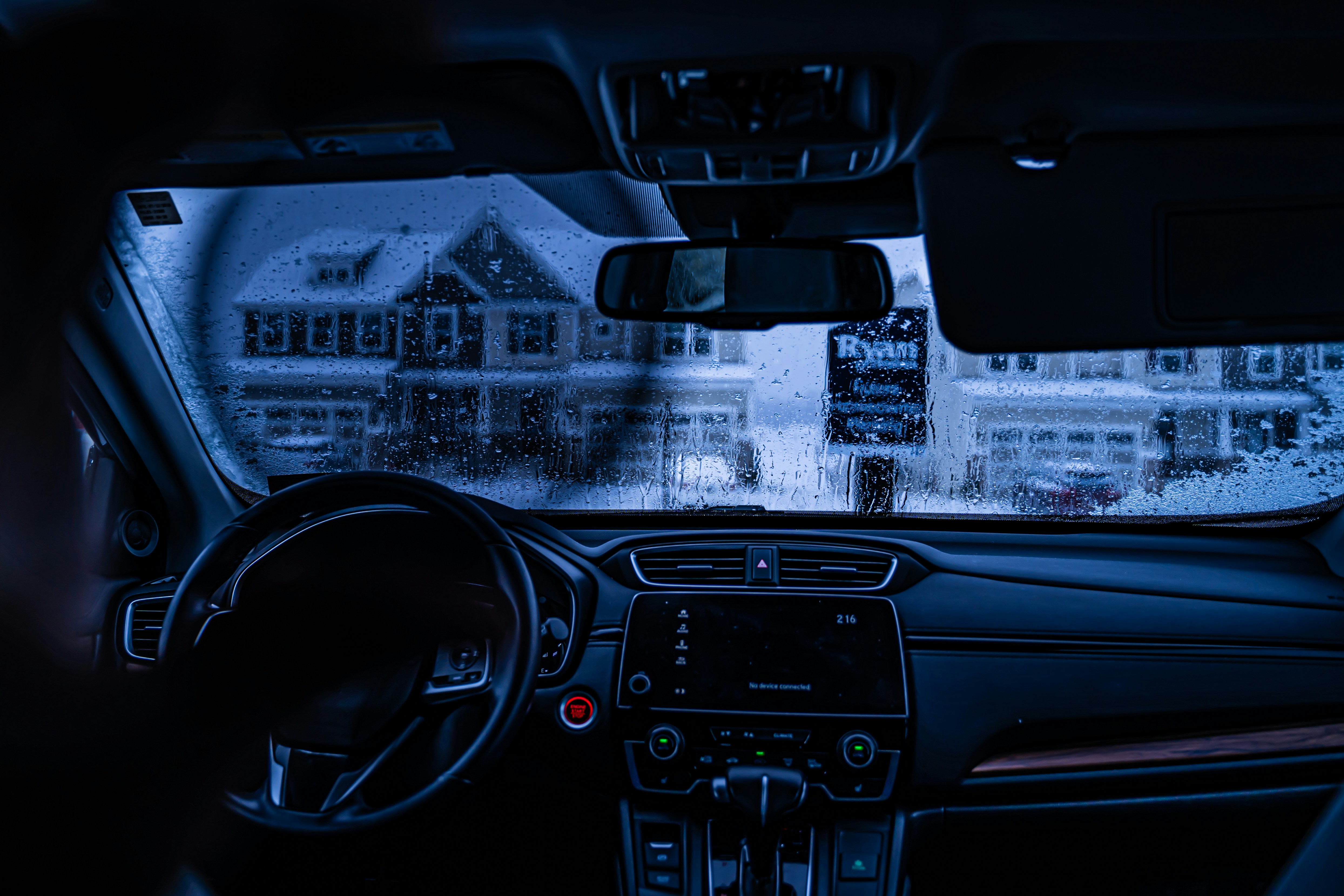 black car steering wheel and dashboard