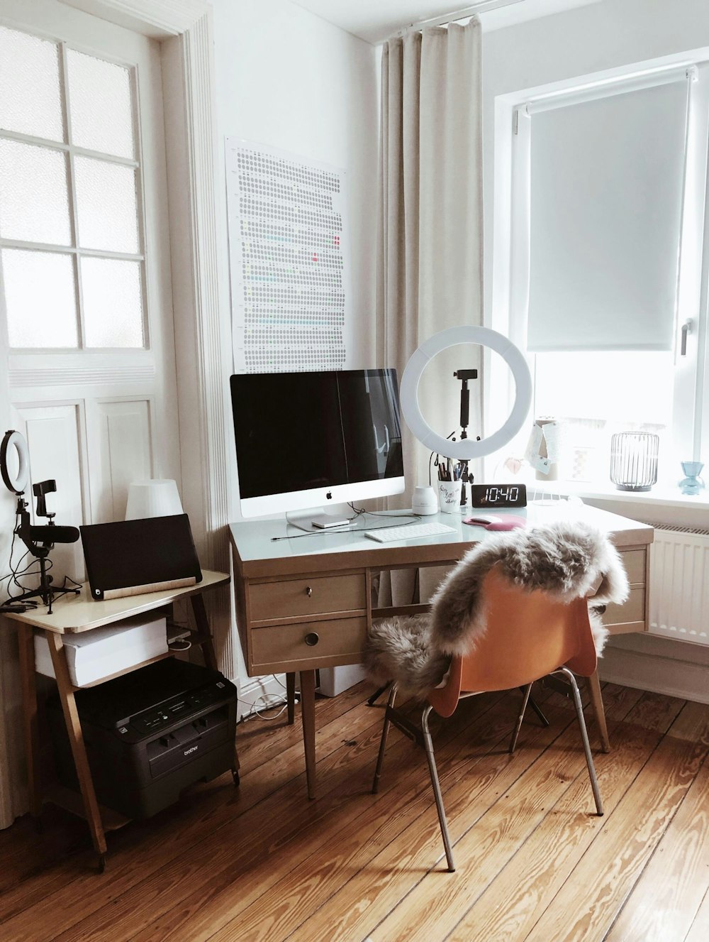 white flat screen computer monitor on brown wooden desk