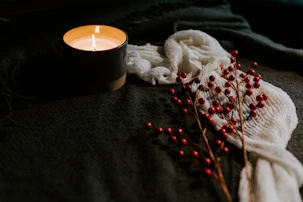 white candle on black holder