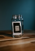 clear glass jar on brown wooden table