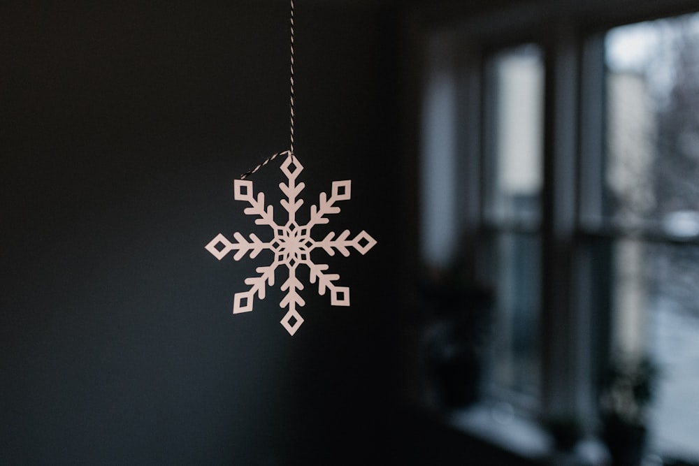 silver and white snowflake pendant