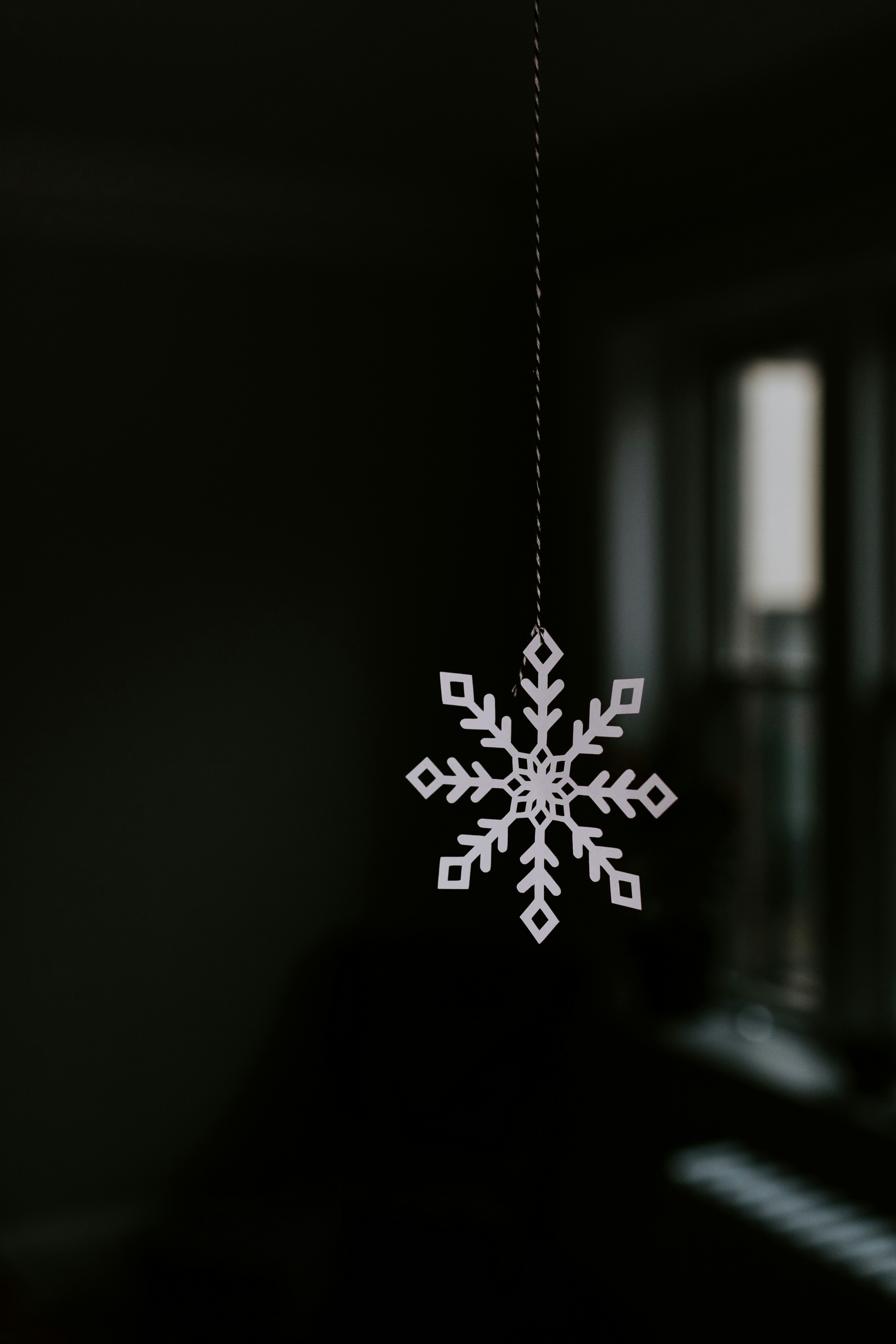 white snowflake in clear glass bottle