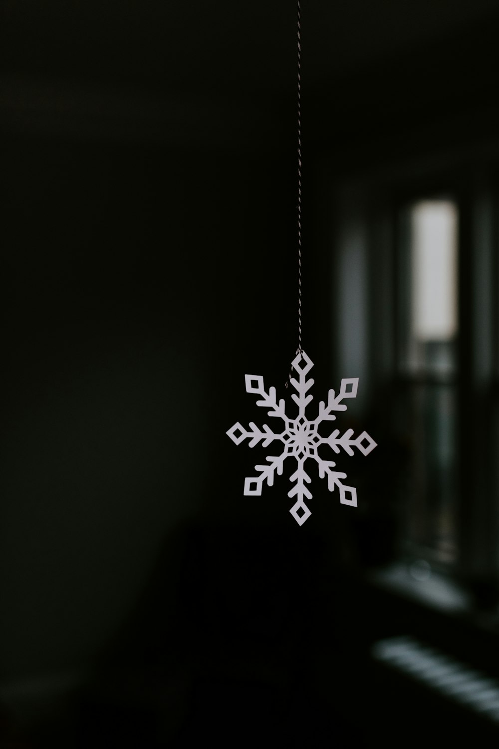 white snowflake in clear glass bottle