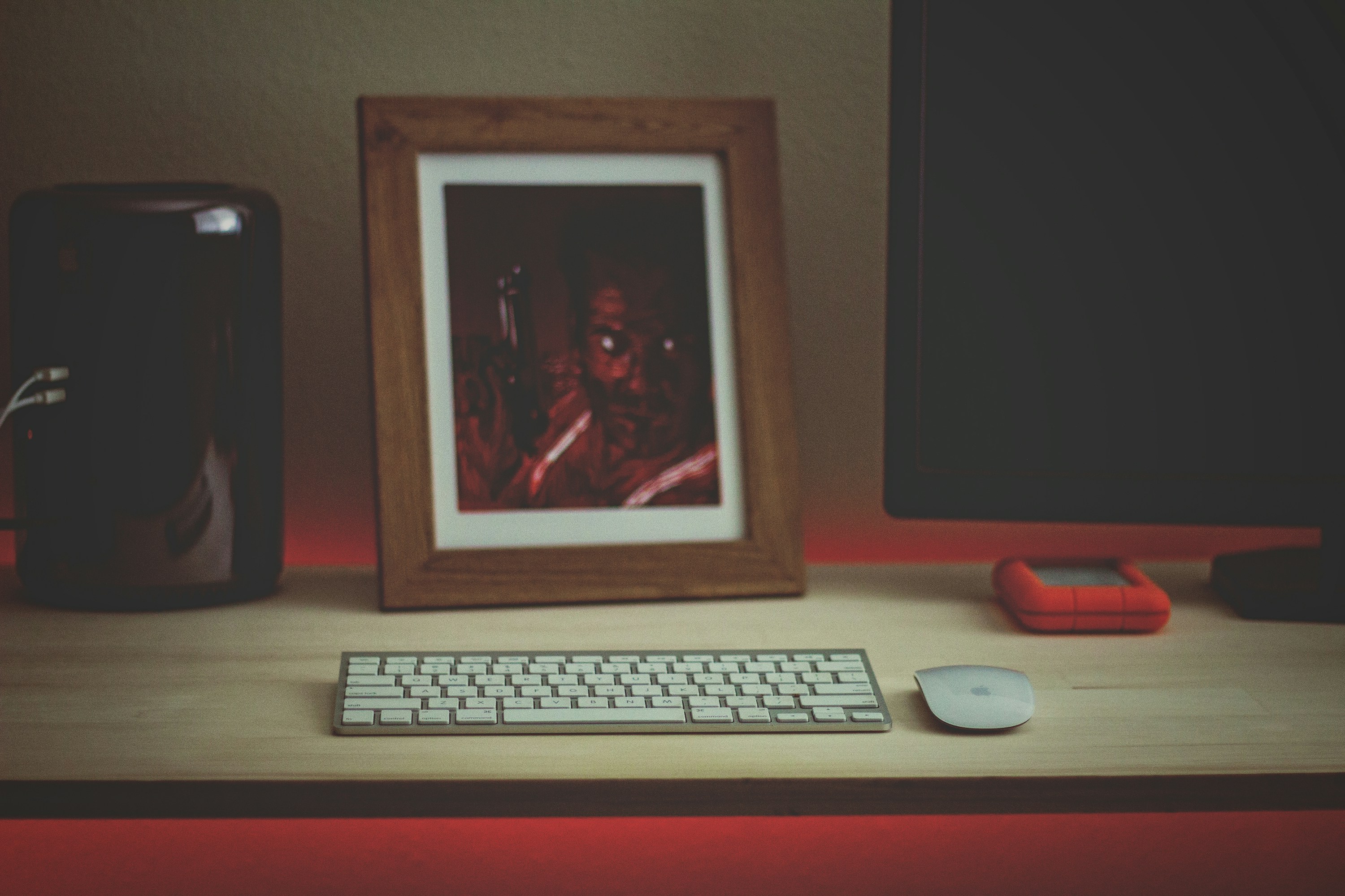 white computer keyboard beside white computer monitor