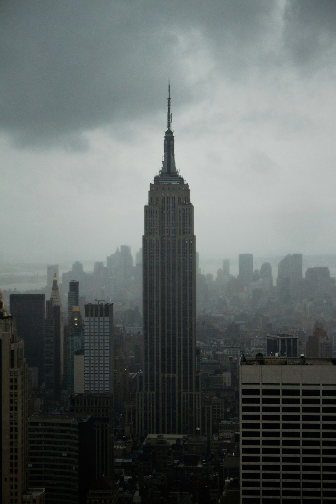 high rise building under white clouds during daytime