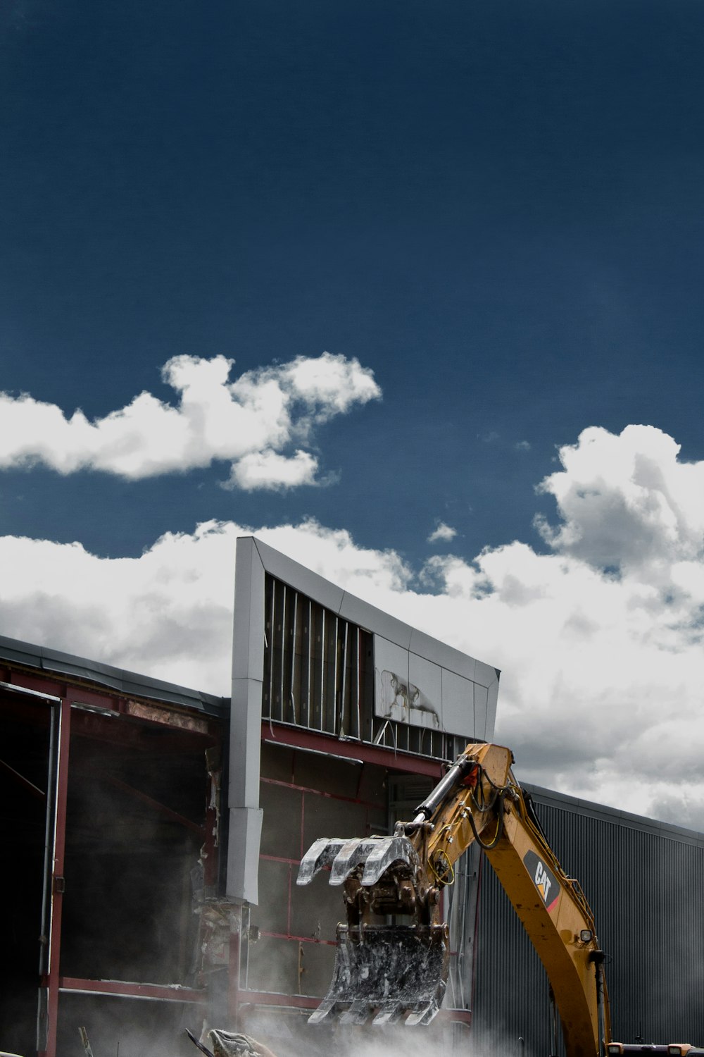 white and black concrete building under blue sky during daytime