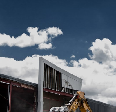 white and black concrete building under blue sky during daytime