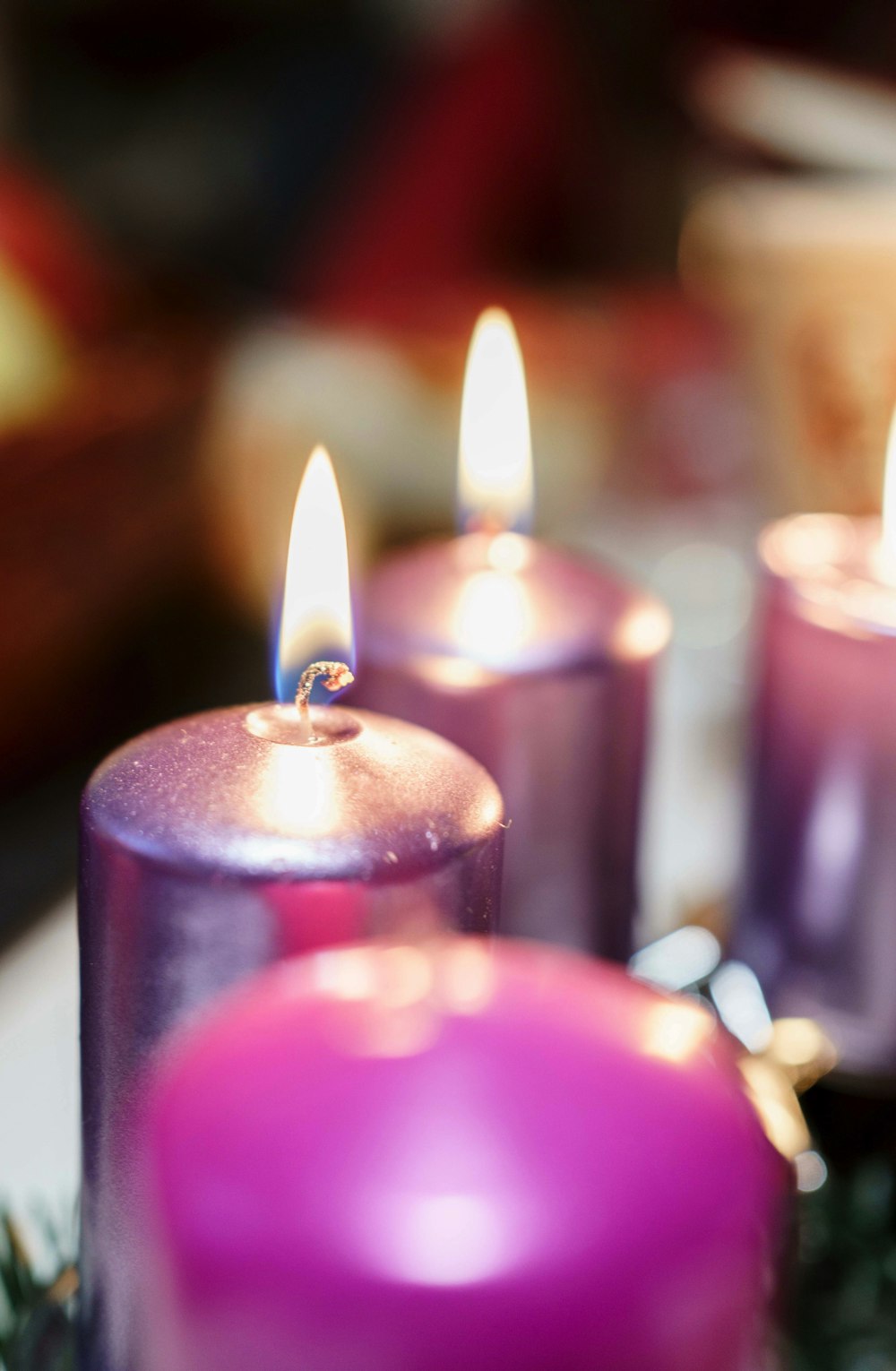 pink candles on focus photography