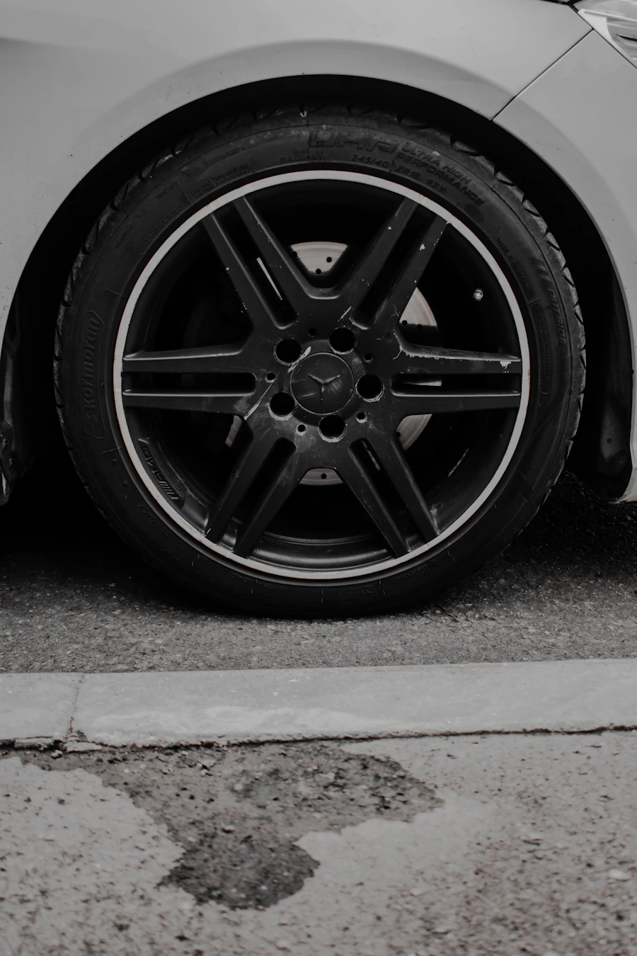 Close-up of a clean alloy wheel and low-profile tire on a car ready for a four-wheel alignment