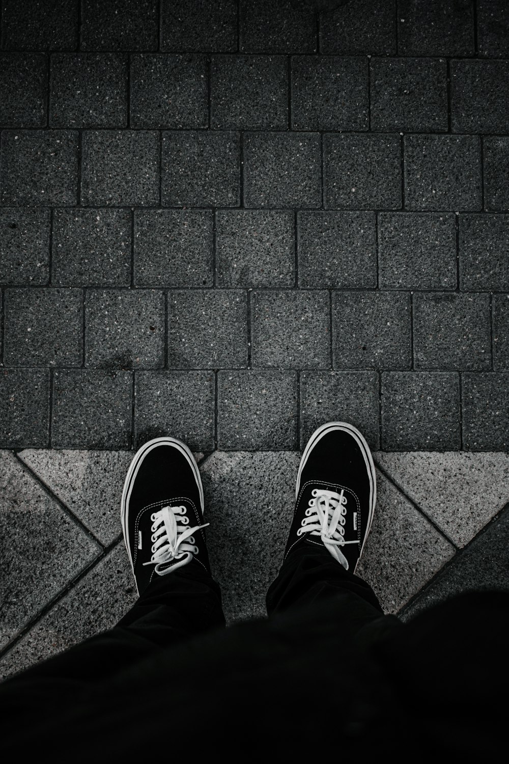 person in black and white sneakers