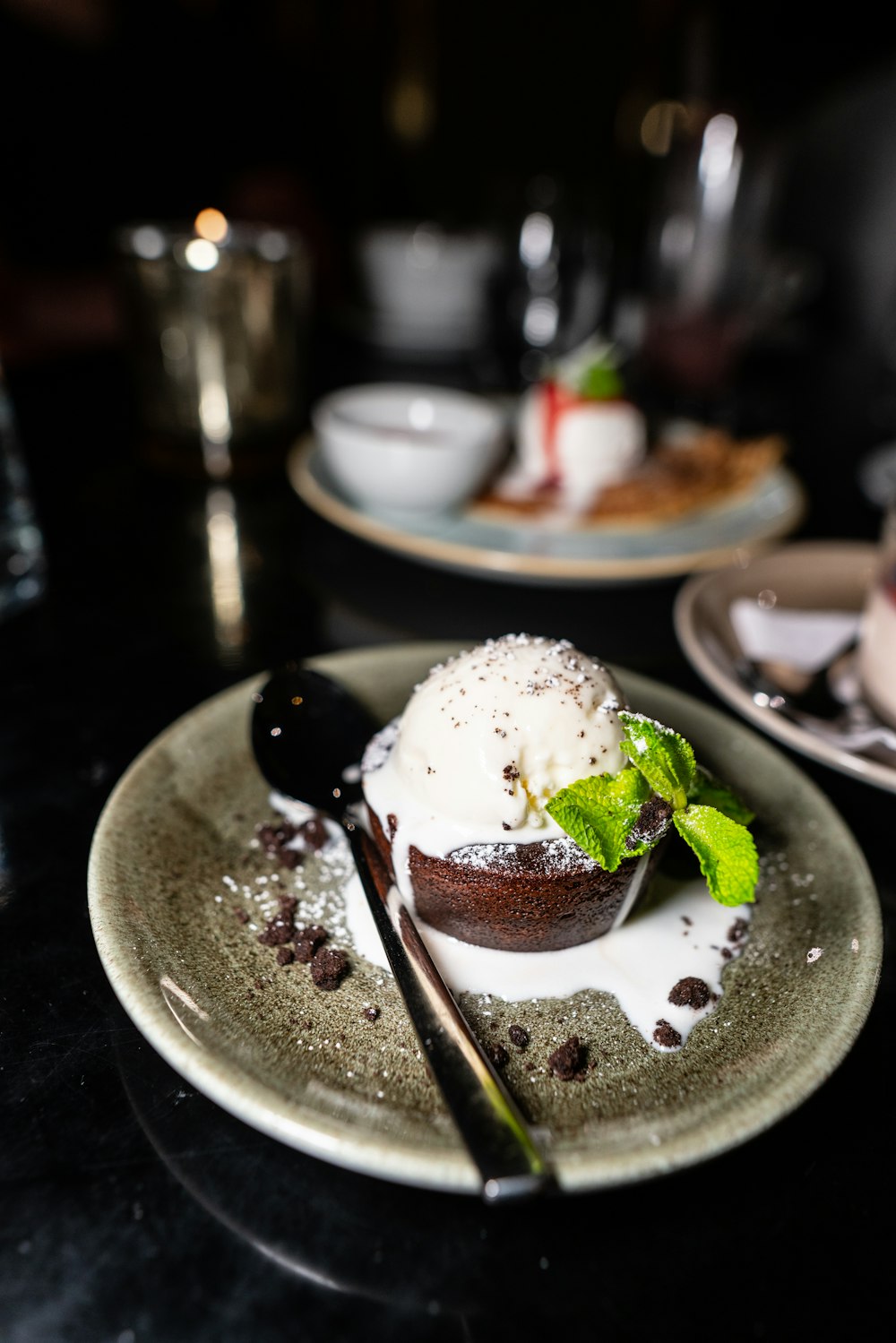 ice cream with strawberry on white ceramic plate