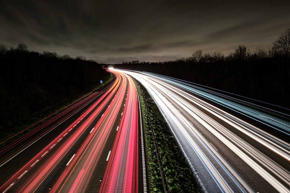 time lapse photography of cars on road during night time