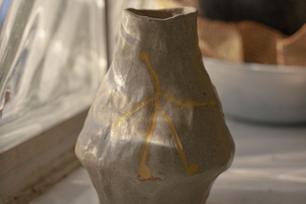 green and brown plant in clear glass vase