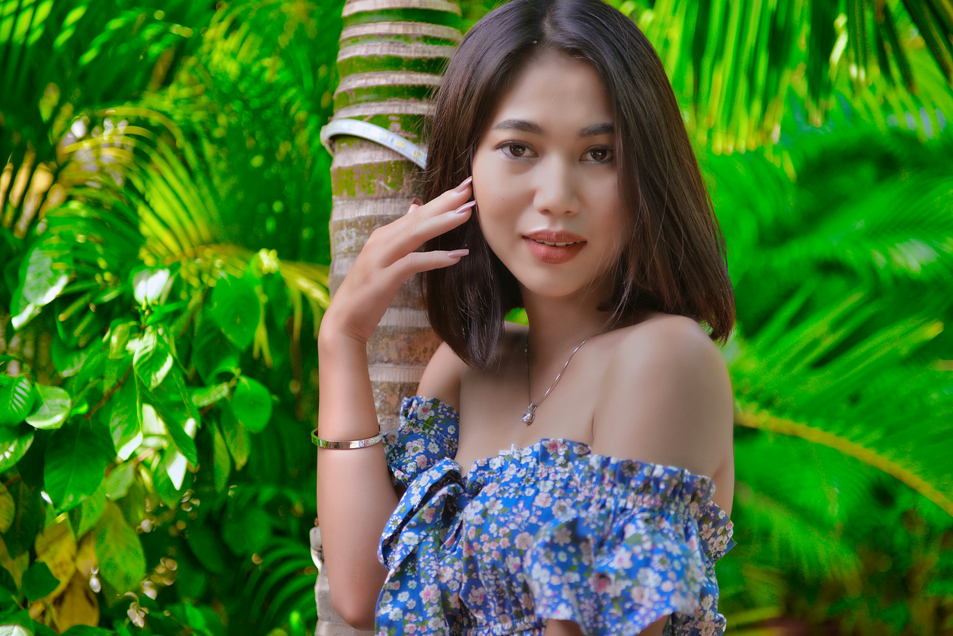 woman in blue and white floral off shoulder dress