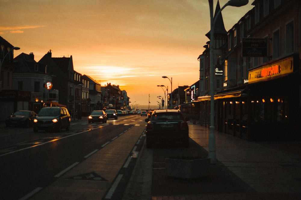 cars on road during sunset