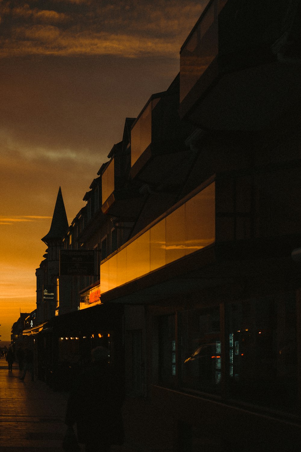 silhouette of buildings during night time