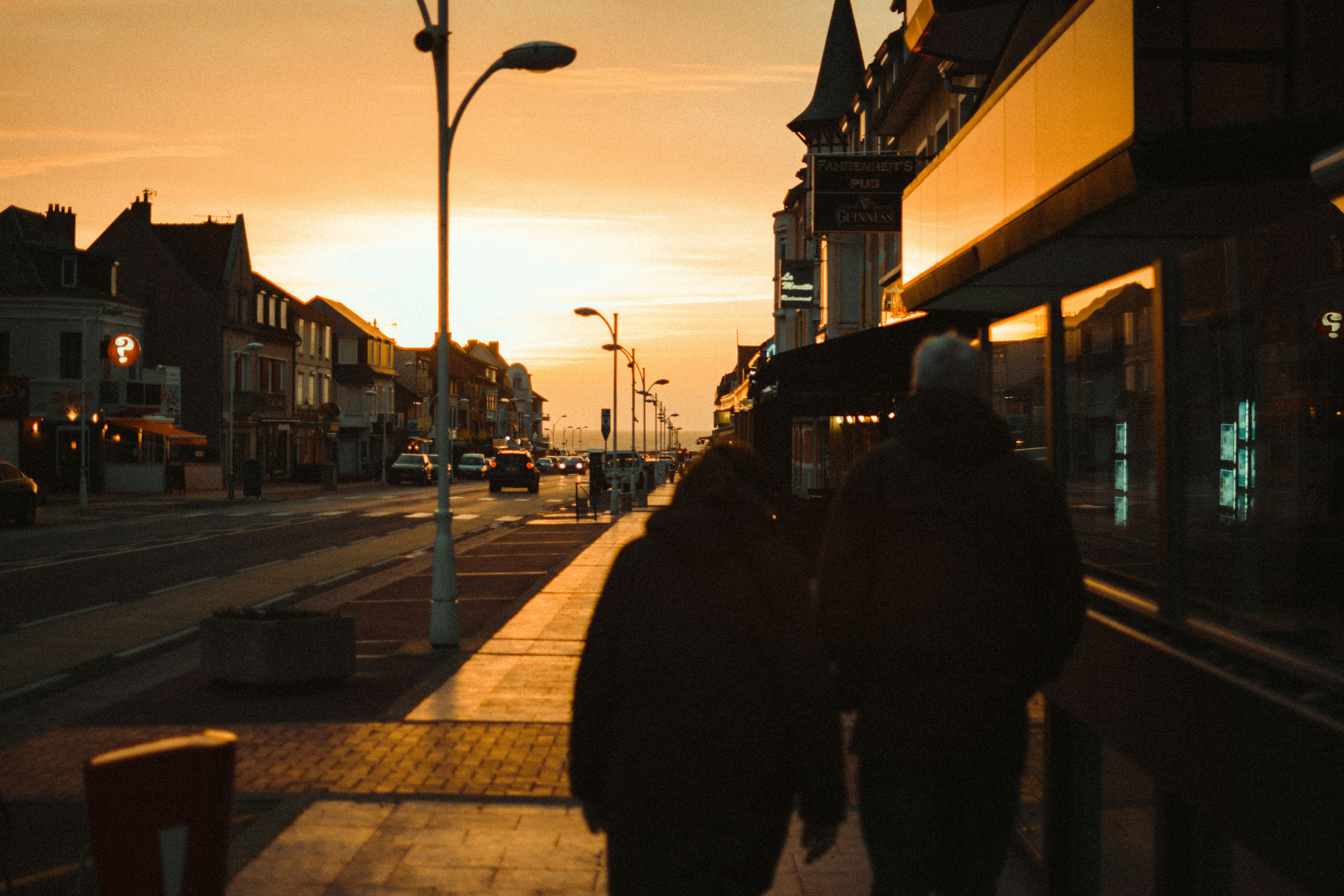 A somber illustration of a broken heart or a silhouette of a grieving family, set against a blurred background of a small town street.