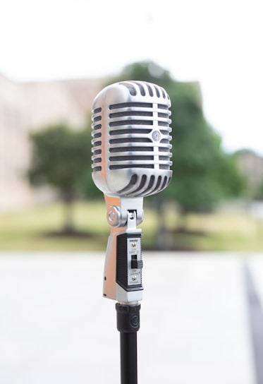 silver microphone on white table