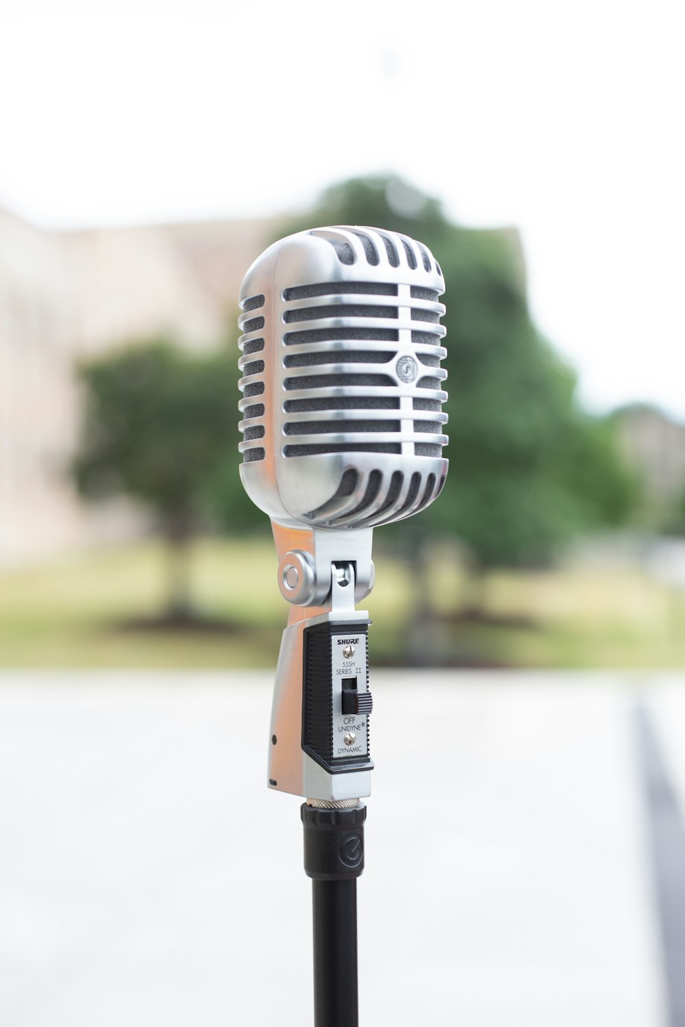 silver microphone on white table