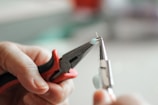 A close-up of hands working together on a project.
