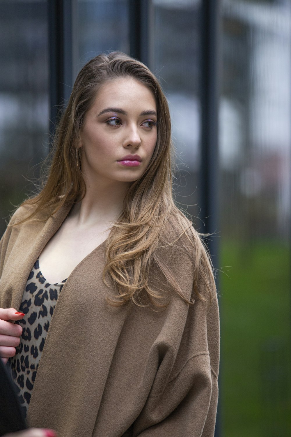 woman in brown and black leopard print coat