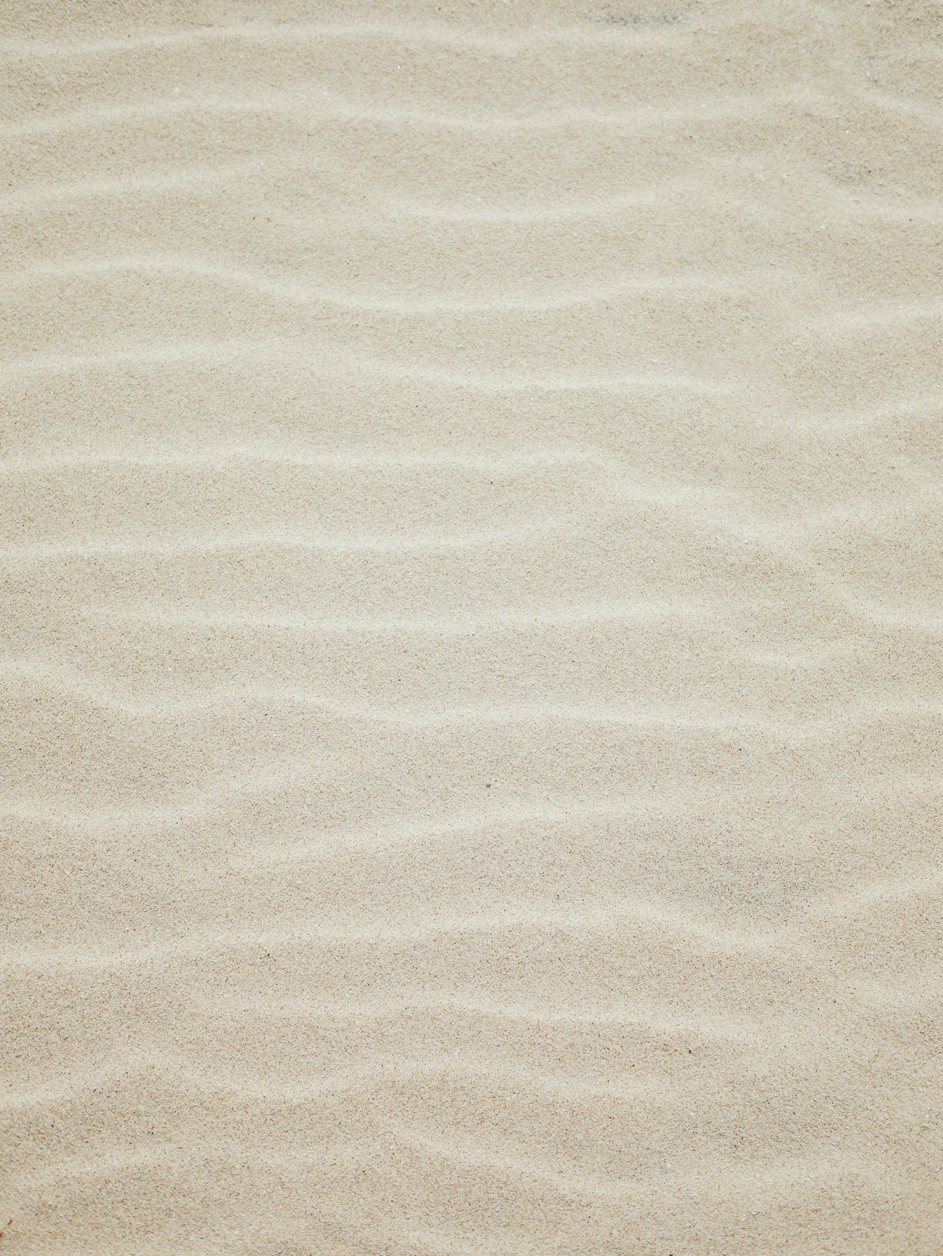 brown sand with shadow of person