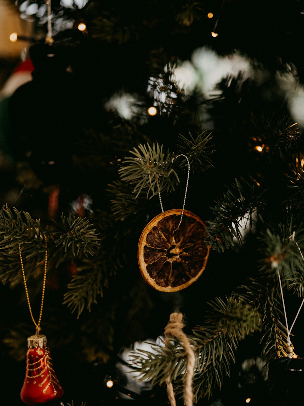 gold round ornament on christmas tree