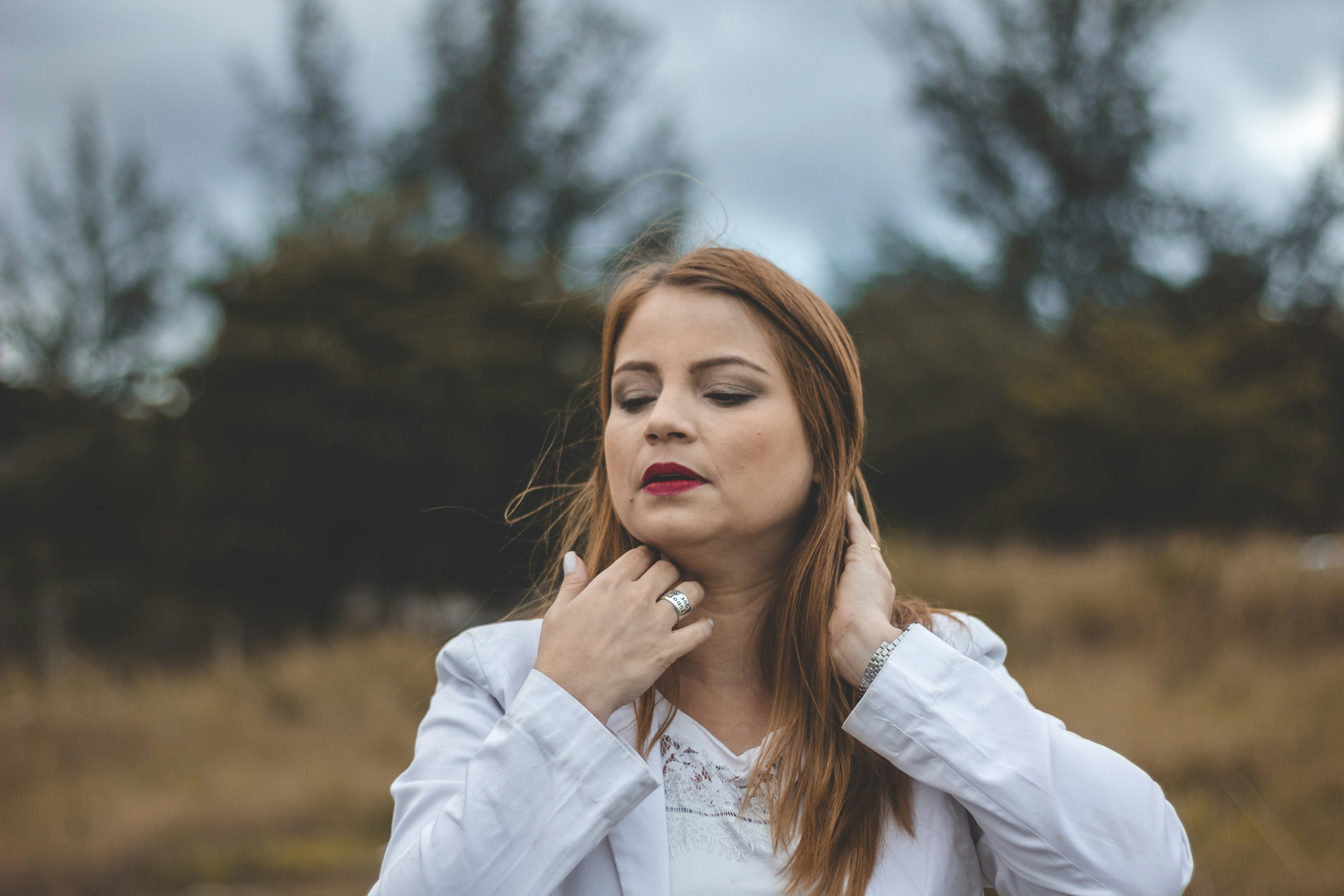 woman in white long sleeve shirt