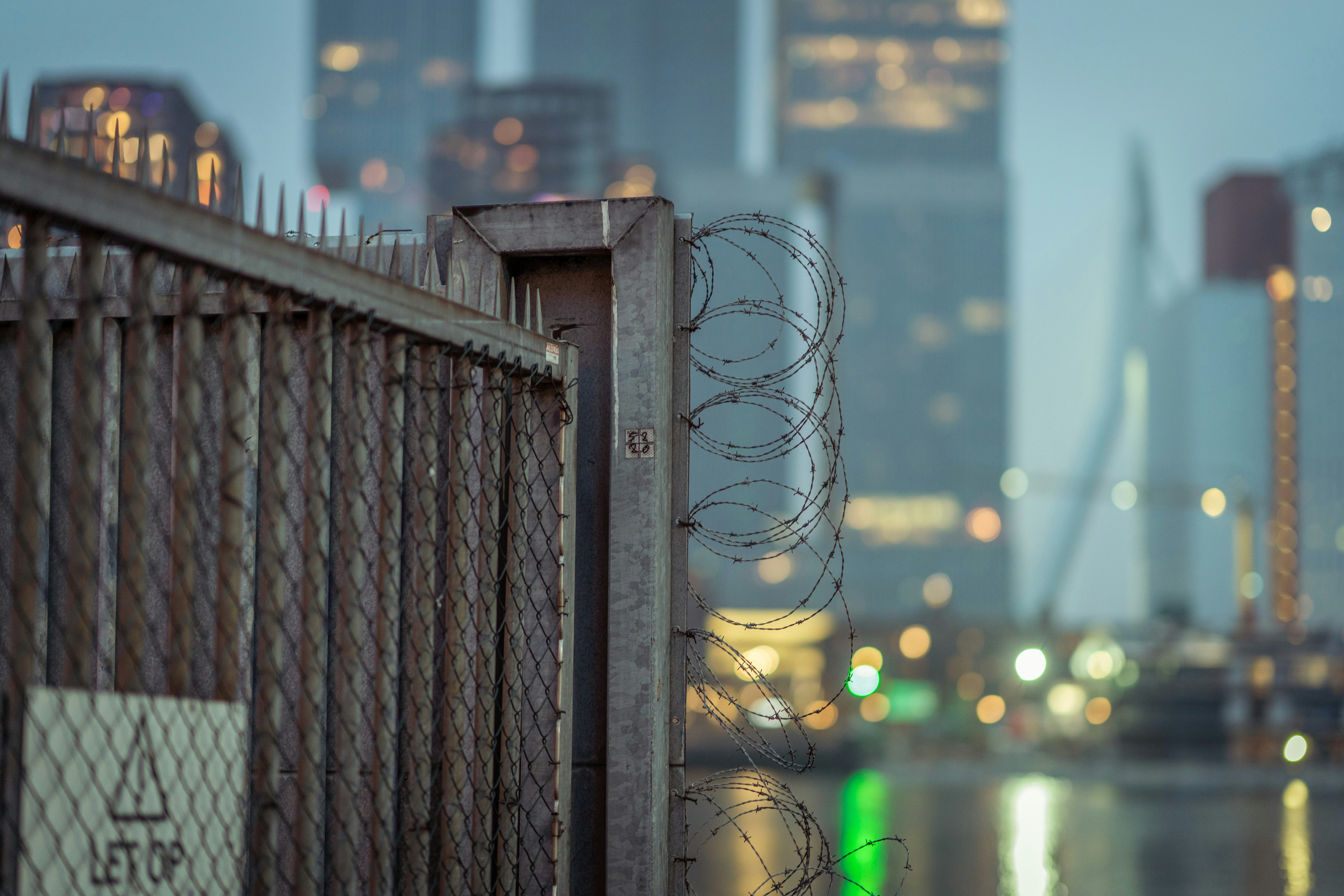 A fence with a skyline on the background