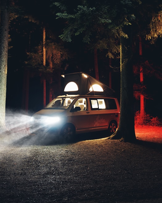 A sleek diesel heater installed inside a camper van, glowing softly during dusk