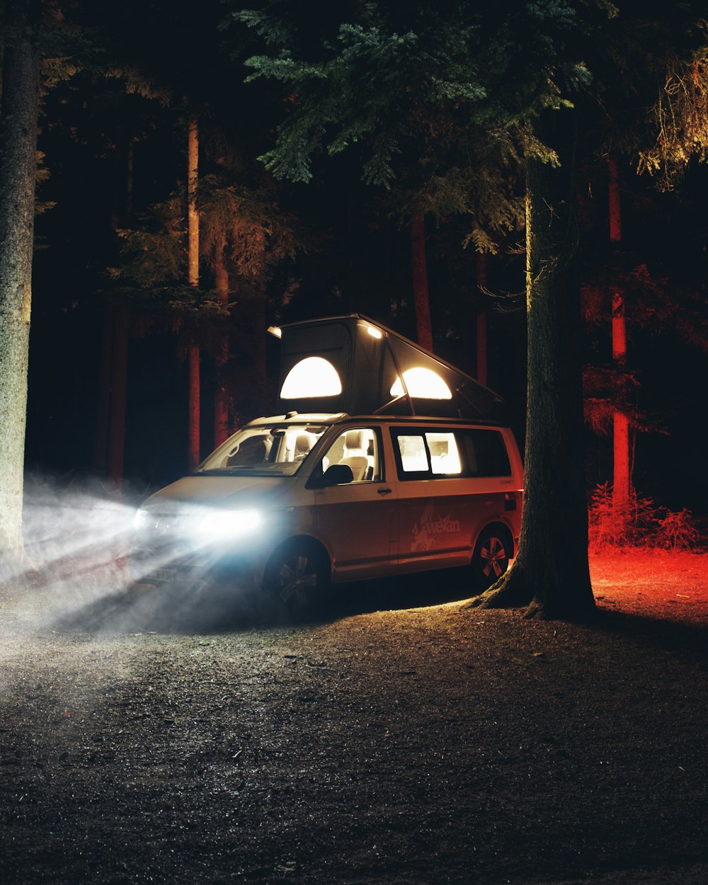 white station wagon on road during night time