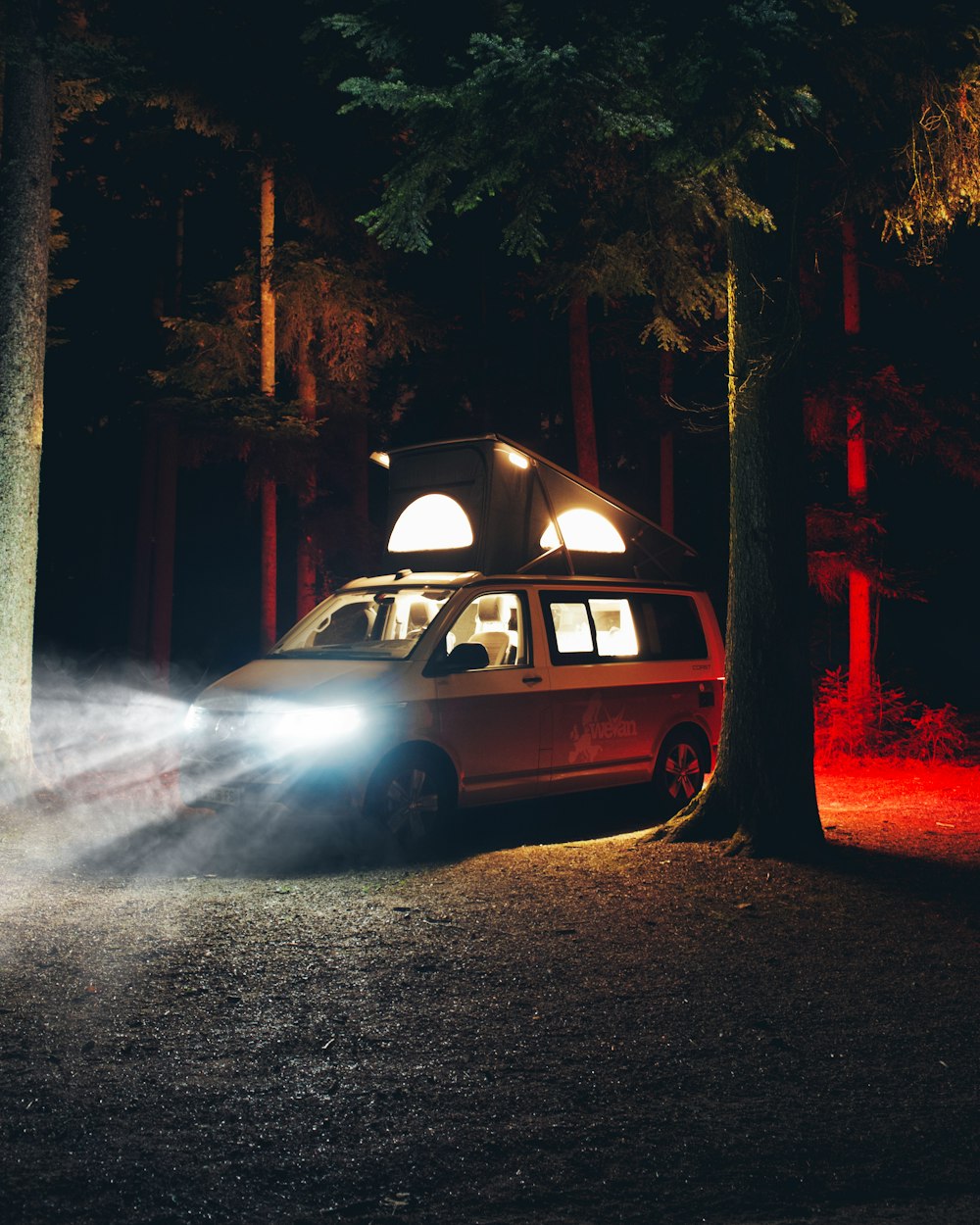white station wagon on road during night time