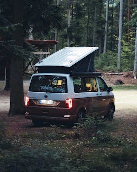 Friendly customer service representative assisting a campervan renter over the phone at night.