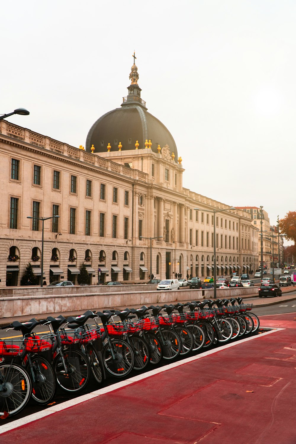 bicycles parked on the side of the road near brown concrete building during daytime