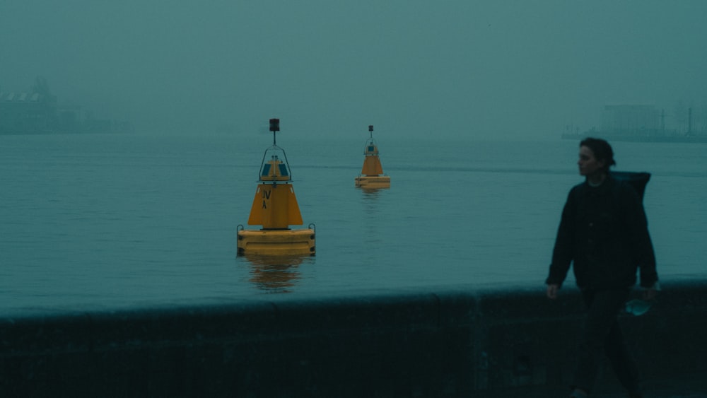 yellow and brown boat on body of water