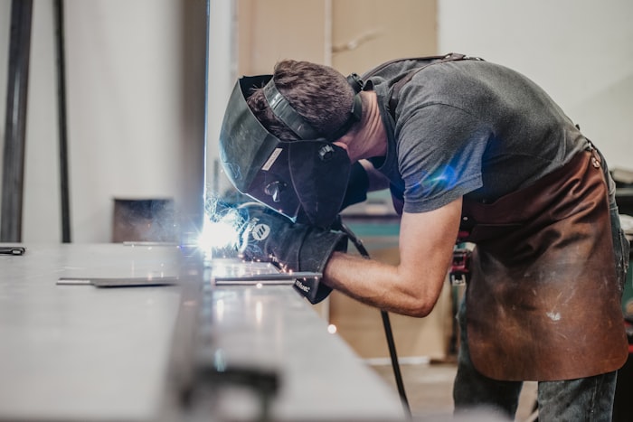 Welder wearing black helmet