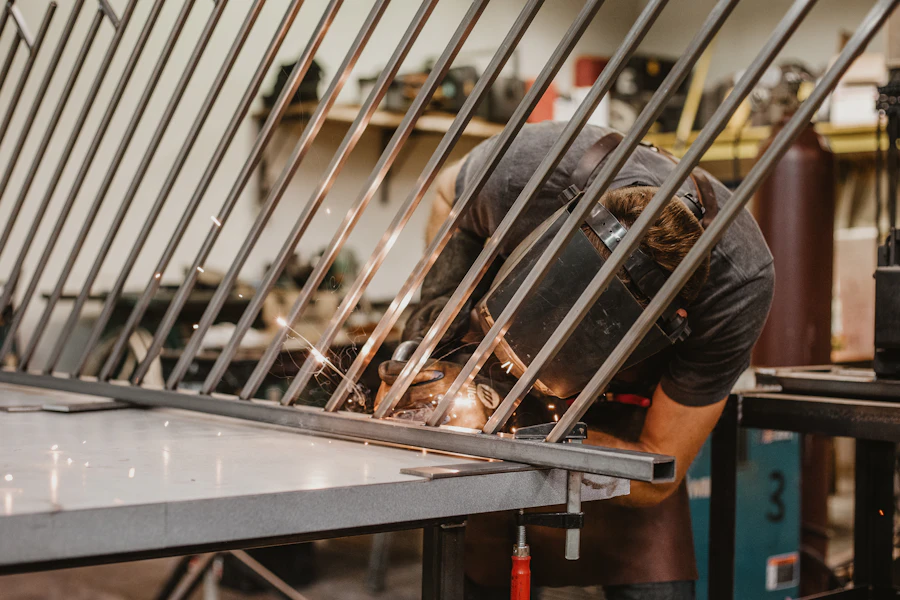 Fabricator assembling welded stainless steel frames and structural metalwork