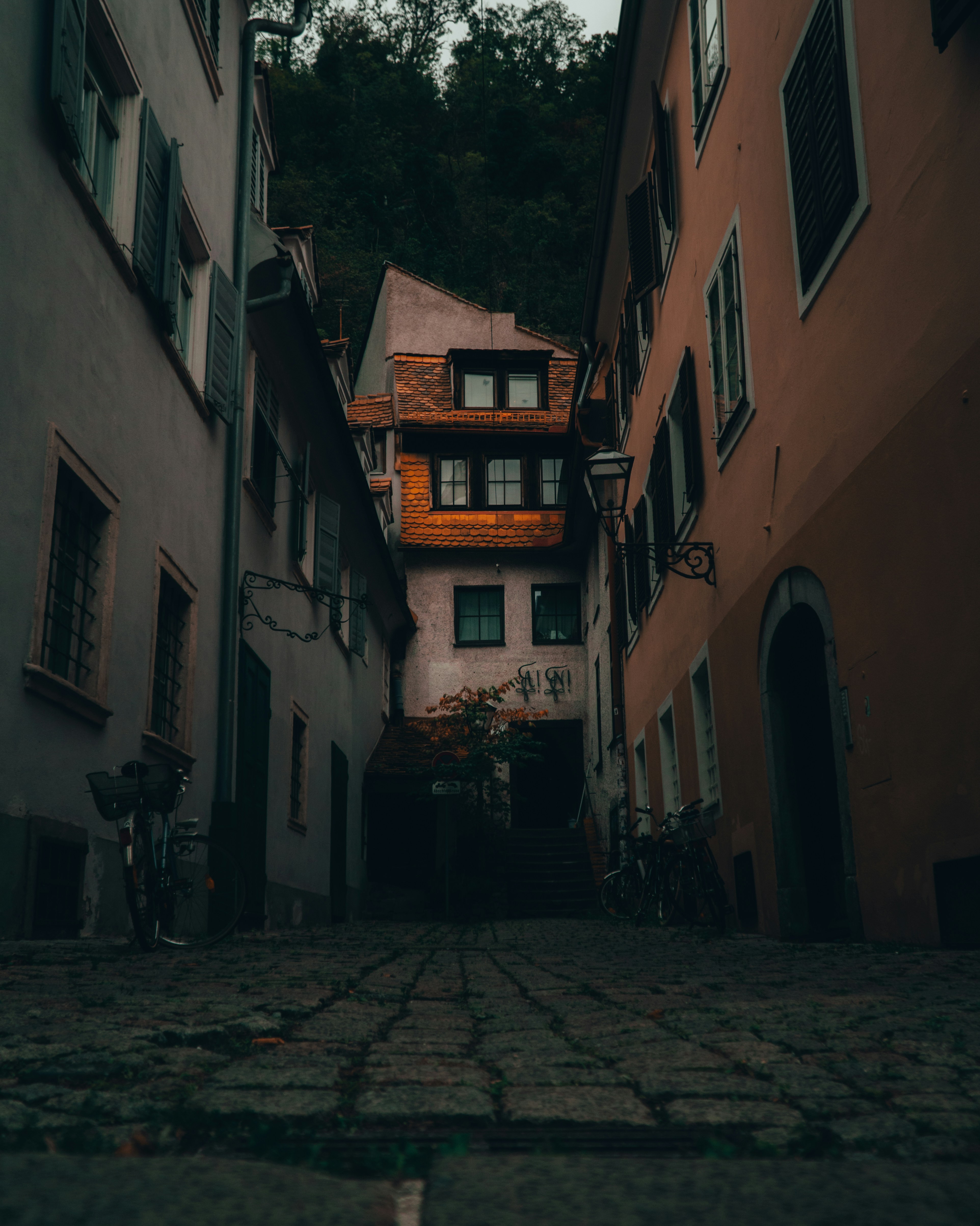 people walking on street between buildings during daytime