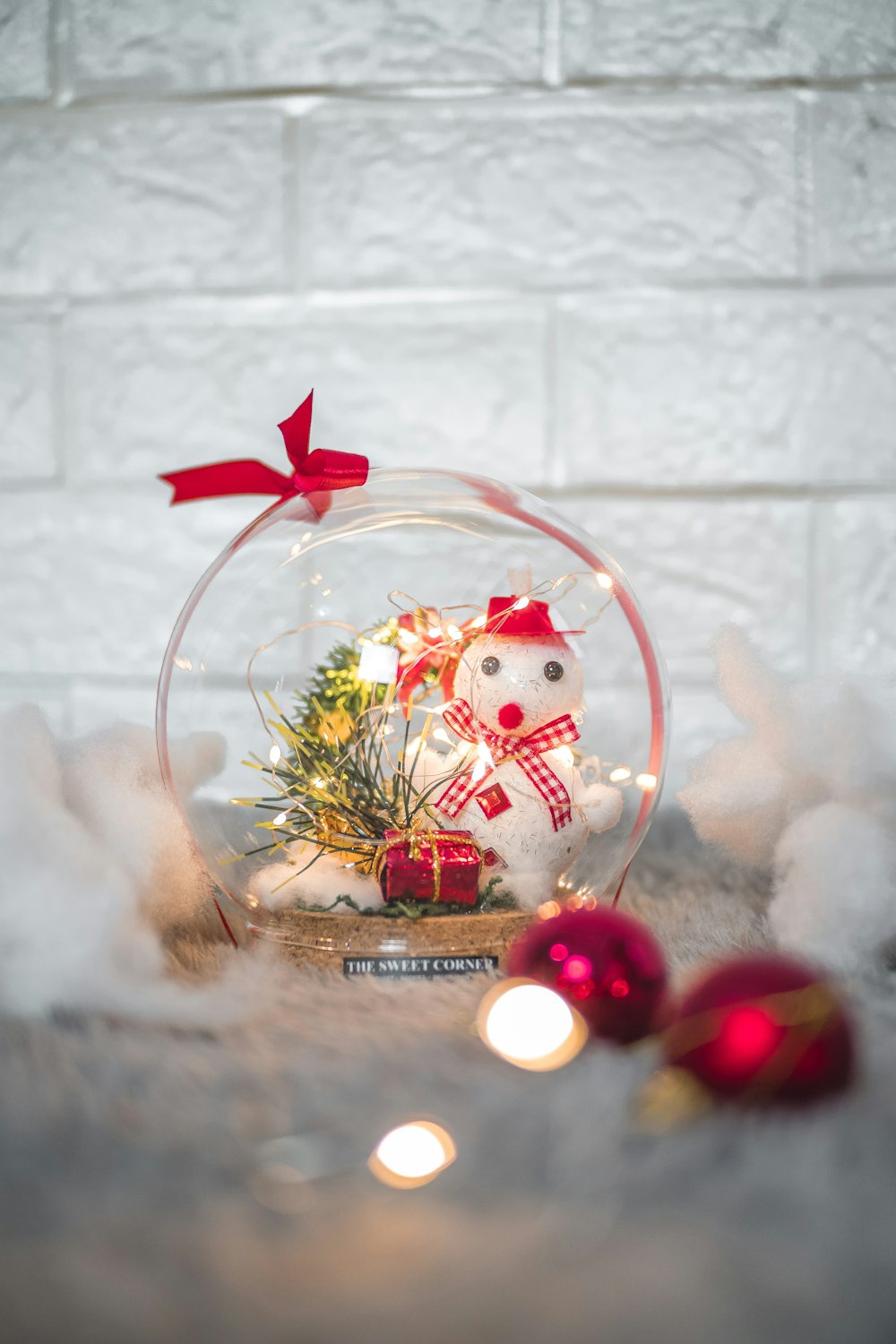 red and white bird on clear glass bowl